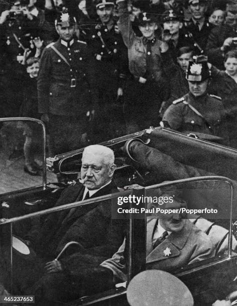 German President Paul von Hindenburg in a car with Nazi leader and Chancellor of Germany, Adolf Hitler , on their way to a Labour Day youth rally at...