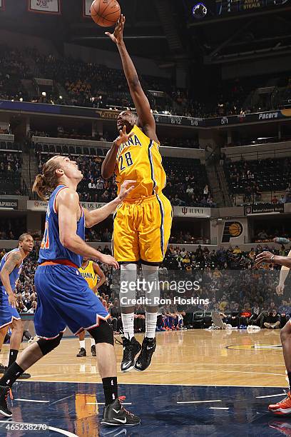 Ian Mahinmi of the Indiana Pacers shoots the ball against the New York Knicks during the game on March 4, 2015 at Bankers Life Fieldhouse in...