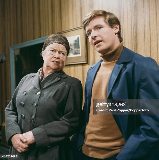 English actress Violet Carson with actor William Roache on the set of the Granada TV soap opera 'Coronation Street', Manchester, 1968. They play Ena...