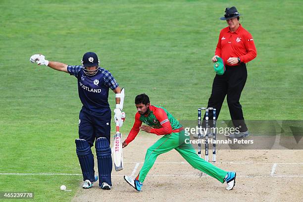 Kyle Coetzer of Scotland runs in to Sabbir Rahman of Bangladesh during the 2015 ICC Cricket World Cup match between Bangladesh and Scotland at Saxton...