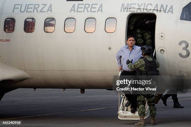 Omar Trevino alias "El Z-42" leader of criminal organisation "Los Zetas" is escorted by Mexican Army after his arrest in the Mexican State of Nuevo...