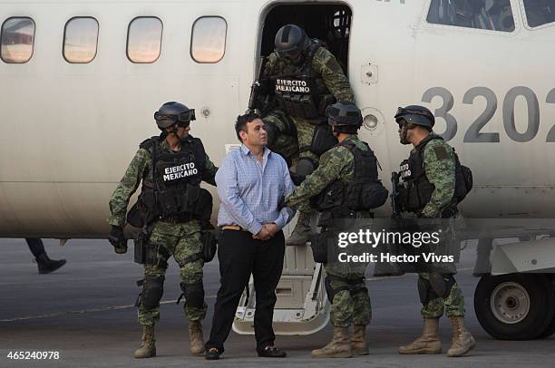 Omar Trevino alias "El Z-42" leader of criminal organisation "Los Zetas" is escorted by Mexican Army after his arrest in the Mexican State of Nuevo...