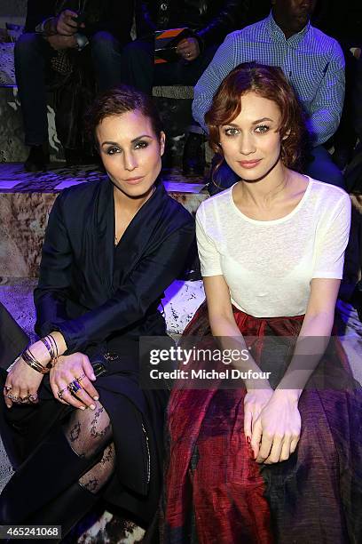 Noomi Rapace and Olga Kurylenko attend the H&M show as part of the Paris Fashion Week Womenswear Fall/Winter 2015/2016 at Grand Palais on March 4,...