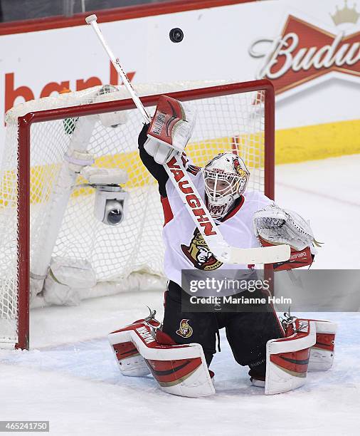 Andrew Hammond of the Ottawa Senators blocks a shot on goal in first-period action in an NHL game against the Winnipeg Jets at the MTS Centre on...
