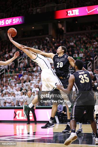 Gavin Schilling of the Michigan State Spartans shoots and draws a foul from A.J. Hammons of the Purdue Boilermakers at the Breslin Center on March 4,...