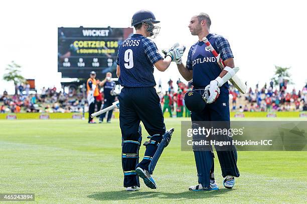 Kyle Coetzer of Scotland is acknowledged by teammate Matthew Cross after being dismissed for 156 off 134 balls during the 2015 ICC Cricket World Cup...