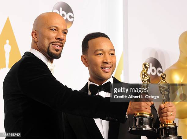 Musicians Common and John Legend winners for Best Song from "Selma" pose inside the press room of the 87th Annual Academy Awards held at Loews...