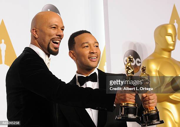 Musicians Common and John Legend winners for Best Song from "Selma" pose inside the press room of the 87th Annual Academy Awards held at Loews...