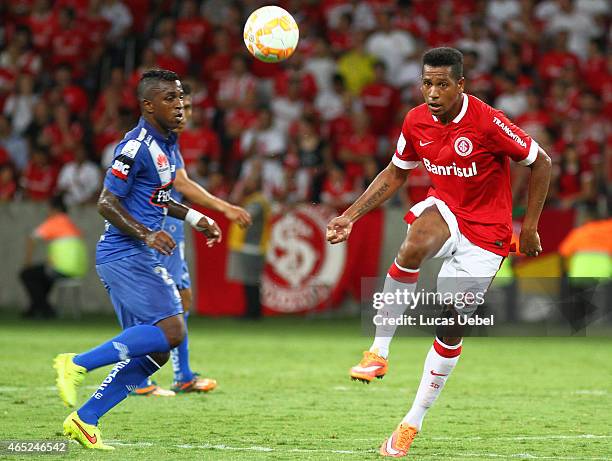 Nicolas Freitas of Internacional battles for the ball against Miller Bolanos of Emelec during match between Internacional and Emelec as part of Copa...