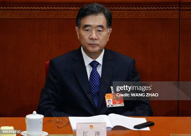 Chinese Vice Premier Wang Yang attends the opening of the third session of the 12th National People's Congress at the Great Hall of the People in...