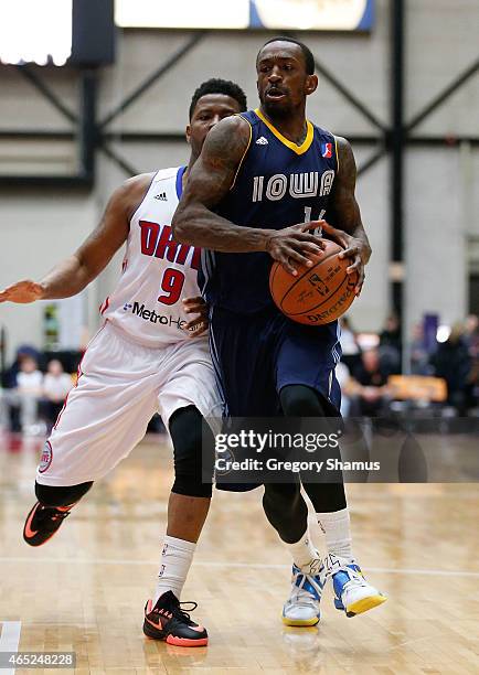 Russ Smith of the Iowa Energy drives around Stefhon Hannah of the Grand Rapids Drive during a NBA Development League game on March 4, 2015 at the...