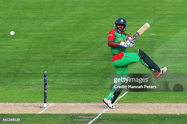 Tamim Iqbal of Bangladesh pulls the ball away for four runs during the 2015 ICC Cricket World Cup match between Bangladesh and Scotland at Saxton...