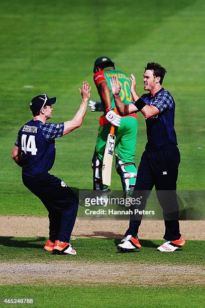 Iain Wardlaw of Scotland celebrates the wicket of Mohammad Mahmudullah of Bangladesh during the 2015 ICC Cricket World Cup match between Bangladesh...