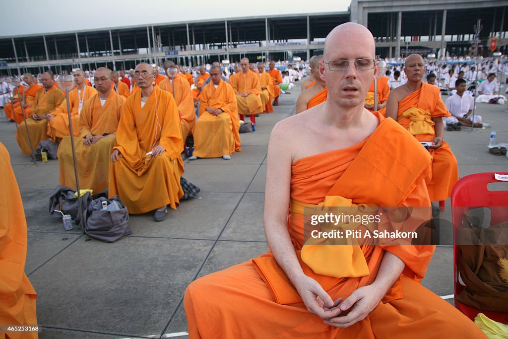 Foreign Buddhist monks take part in the candle lighting...