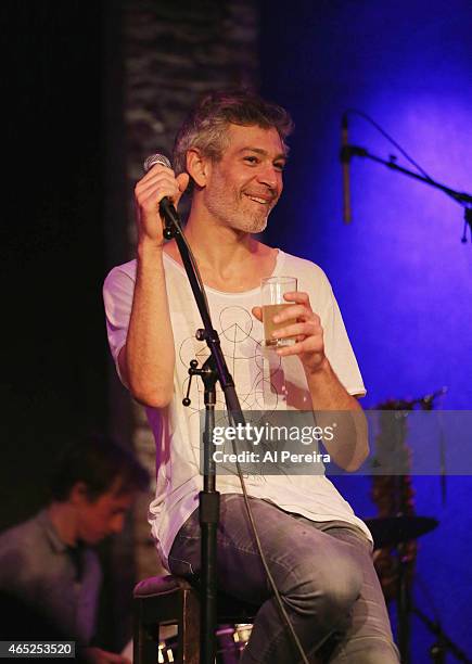 Matisyahu has a drink when he performs at City Winery on March 4, 2015 in New York City.