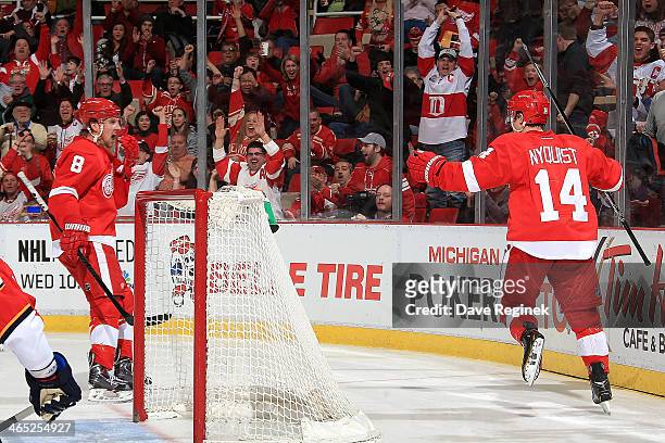 The hometown crowd jumps out of their seats as Gustav Nyquist of the Detroit Red Wings skates over to teammate Justin Abdelkader to celebrate after...