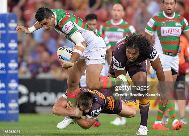 Bryson Goodwin of the Rabbitohs takes on the defence during the round one NRL match between the Brisbane Broncos and the South Sydney Rabbitohs at...