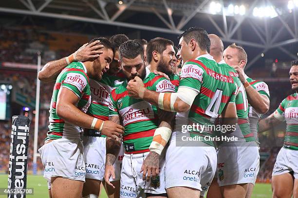 Dylan Walker of the Rabbitohs celebrates a try during the round one NRL match between the Brisbane Broncos and the South Sydney Rabbitohs at Suncorp...