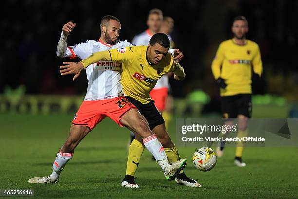 Troy Deeney of Watford tangles with Jazz Richards of Fulham during the Sky Bet Championship match between Watford and Fulham at Vicarage Road on...