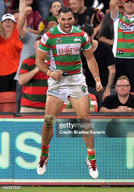 Greg Inglis of the Rabbitohs celebrates after scoring a try during the round one NRL match between the Brisbane Broncos and the South Sydney...