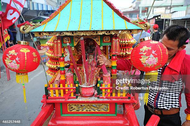 Member of Tatung prepares offerings to God during Cap Go Meh celebrations on March 5, 2015 in Singkawang, Kalimantan, Indonesia. The ancient art of...