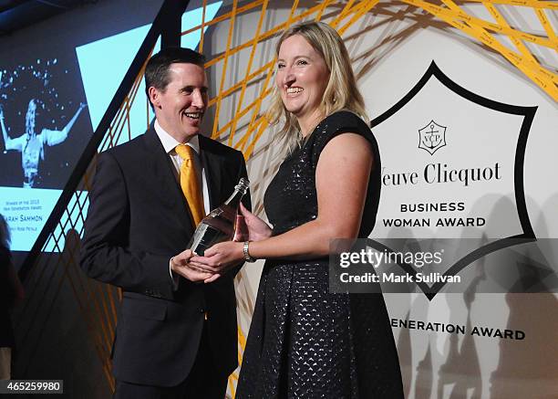 Veuve Clicquot's Andrew McLaren presents Sarah Sammon co-founder of Simply Rose Petals the winner of the Veuve Clicquot New Generation Award with her...