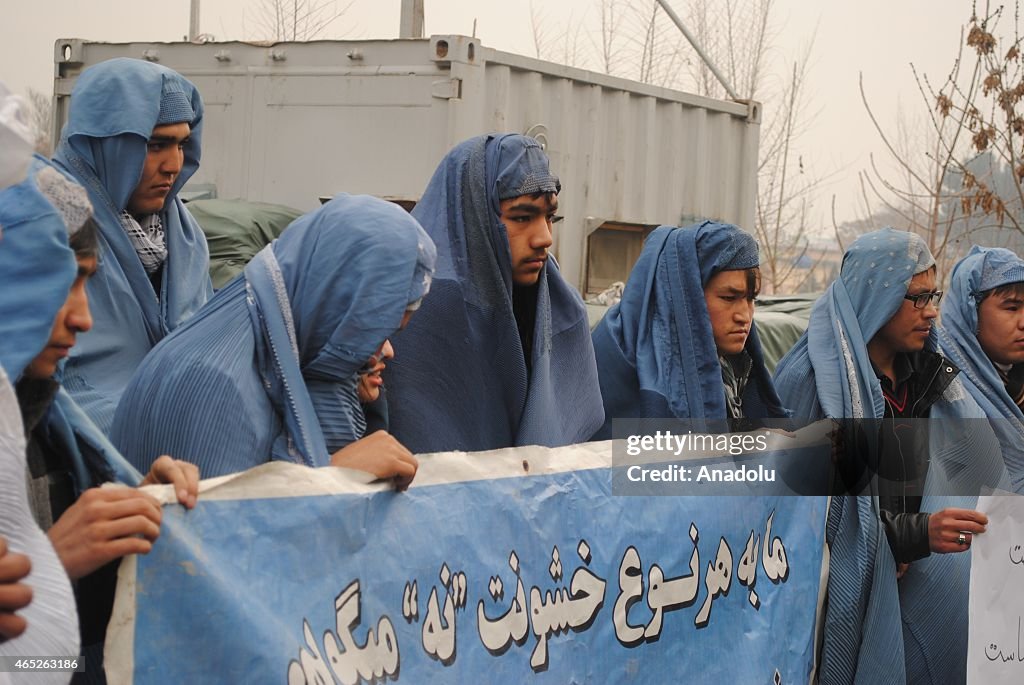 Afghan men protest violence against women