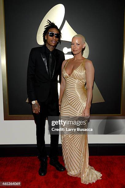 Hip hop artist Wiz Khalifa featured wearing Converse in support of the GRAMMY Foundation's GRAMMY Camp and Amber Rose attend the 56th GRAMMY Awards...