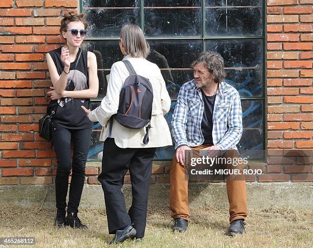 Award-winning Serbian filmmaker Emir Kusturica speaks by his daughter Dunja during a break as he records a documentary of former Uruguayan President...