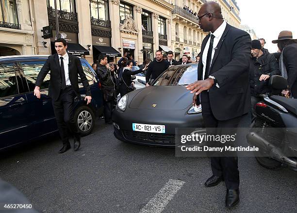 Kanye West car has security escort as it leaves the BALMAIN fashion show at the Grand Hotel due to the huge crowd during Paris Fashion Week Fall...