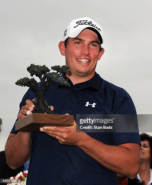 Scott Stallings poses with the trophy after winning the Farmers Insurance Open at Torrey Pines Golf Course on January 26, 2014 in La Jolla,...