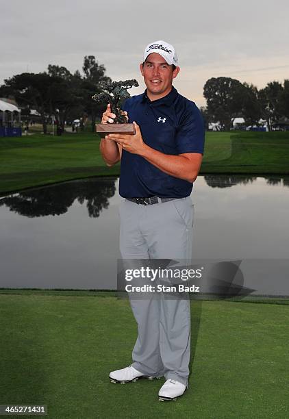 Scott Stallings poses with the trophy after winning the Farmers Insurance Open at Torrey Pines Golf Course on January 26, 2014 in La Jolla,...