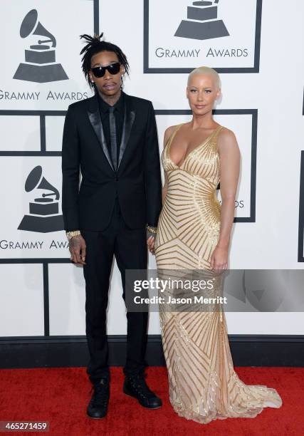 Rapper Wiz Khalifa featured wearing Converse in support of the GRAMMY Foundation's GRAMMY Camp and model Amber Rose attend the 56th GRAMMY Awards at...