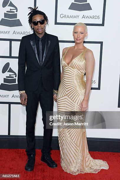 Rapper Wiz Khalifa featured wearing Converse in support of the GRAMMY Foundation's GRAMMY Camp and model Amber Rose attend the 56th GRAMMY Awards at...