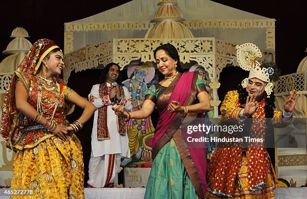 Bollywood actress and BJP MP from Mathura, Hema Malini takes part in the Holi celebration programme at CGA ground near Karkardooma Court on March 5,...