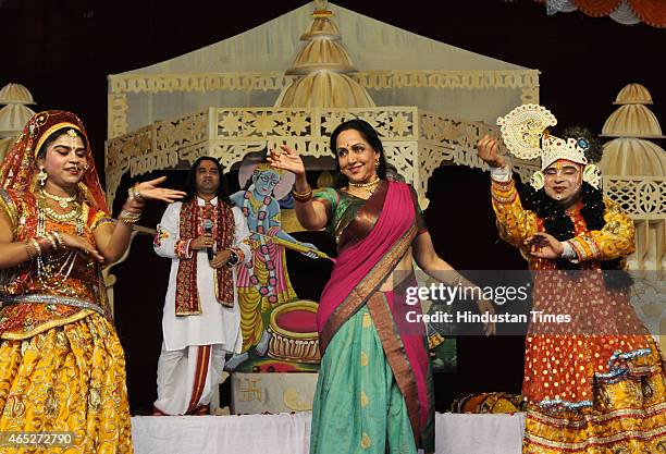 Bollywood actress and BJP MP from Mathura, Hema Malini takes part in the Holi celebration programme at CGA ground near Karkardooma Court on March 5,...