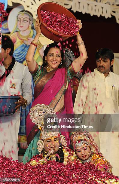 Bollywood actress and BJP MP from Mathura, Hema Malini takes part in the Holi celebration programme at CGA ground near Karkardooma Court on March 5,...