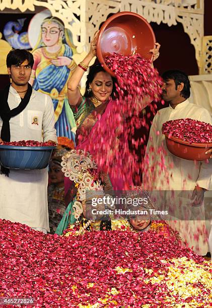 Bollywood actress and BJP MP from Mathura, Hema Malini takes part in the Holi celebration programme at CGA ground near Karkardooma Court on March 5,...