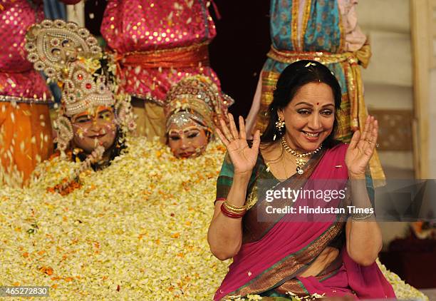 Bollywood actress and BJP MP from Mathura, Hema Malini takes part in the Holi celebration programme at CGA ground near Karkardooma Court on March 5,...