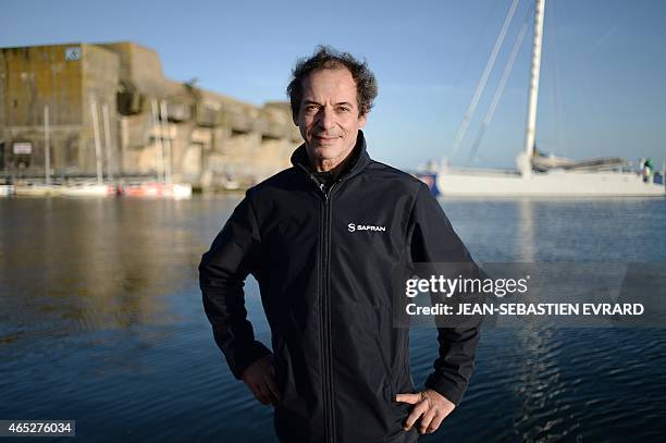 French skipper Marc Guillemot poses as the new Class Imoca Monohull "Safran" is launched on March 5, 2015 in Lorient, western France. French skipper...