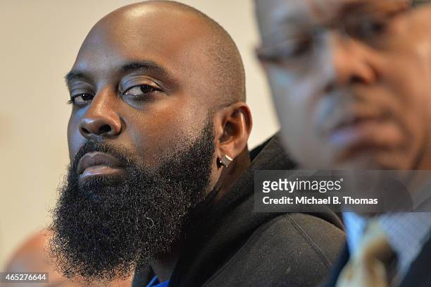 Michael Brown Sr. , father of slain teenager Michael Brown Jr., listens during a press conference at the Greater St. Mark Missionary Baptist Church...