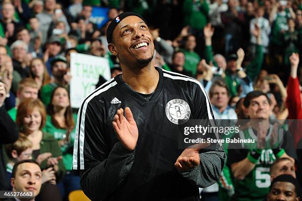 Paul Pierce of the Brooklyn Nets looks up at the video tribute during a time out against the Boston Celtics on January 26, 2014 at the TD Garden in...