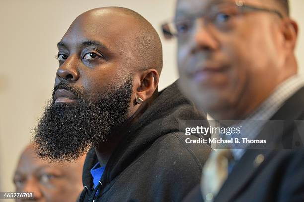 Michael Brown Sr. , father of slain teenager Michael Brown Jr., listens during a press conference at the Greater St. Mark Missionary Baptist Church...