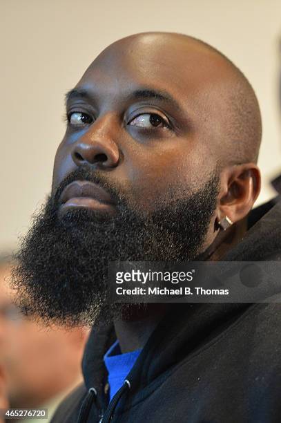 Michael Brown Sr. , father of slain teenager Michael Brown Jr., listens during a press conference at the Greater St. Mark Missionary Baptist Church...