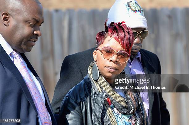Lesley McSpadden, mother of slain teenager Michael Brown Jr., exits after a press conference at the Greater St. Mark Missionary Baptist Church on...