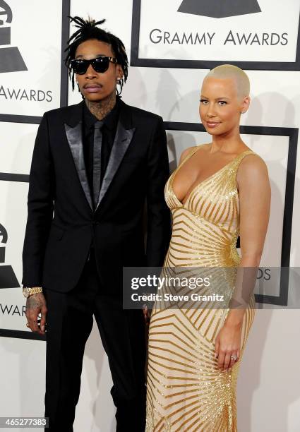 Recording artist Wiz Khalifa featured wearing Converse in support of the GRAMMY Foundation's GRAMMY Camp and model Amber Rose attend the 56th GRAMMY...