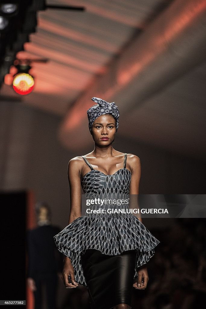 A model presents a creation by Khosi Nkosi during the Mercedes Benz ...
