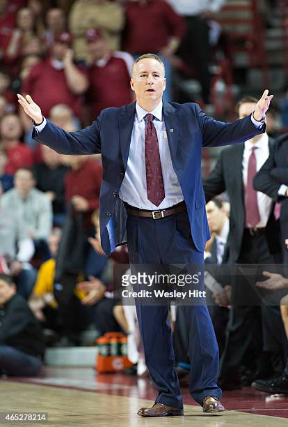 Head Coach Billy Kennedy of the Texas A&M Aggies watches his team during a game against the Arkansas Razorbacks at Bud Walton Arena on February 24,...