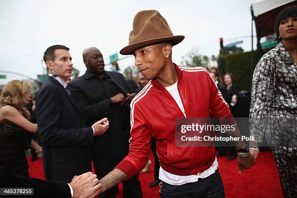 Recording artist Pharrell Williams and Helen Lasichanh attend the 56th GRAMMY Awards at Staples Center on January 26, 2014 in Los Angeles, California.