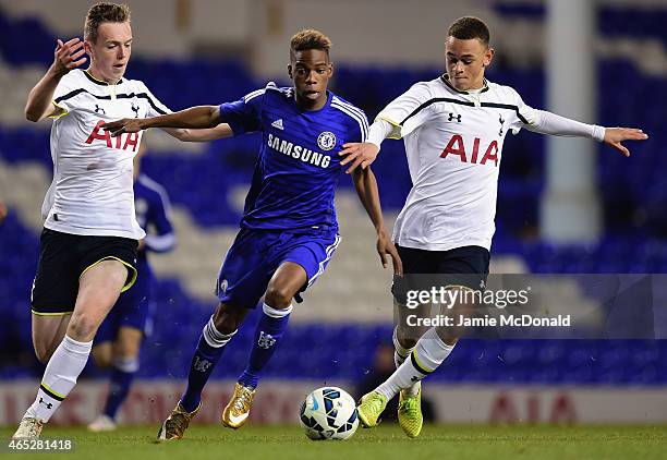 Charly Musonda of Chelsea battles with Luke Amos and Charlie Owens of Spurs during the FA Youth Cup Semi Final, first leg match between Tottenham...